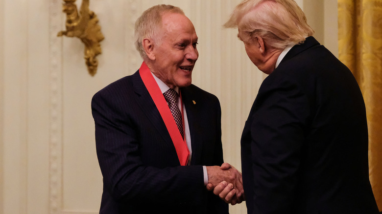 Patrick O'Connell wearing National Humanities Medal next to former President Trump