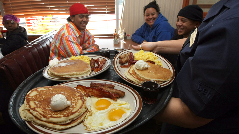 waitress serving Grand Slam breakfasts