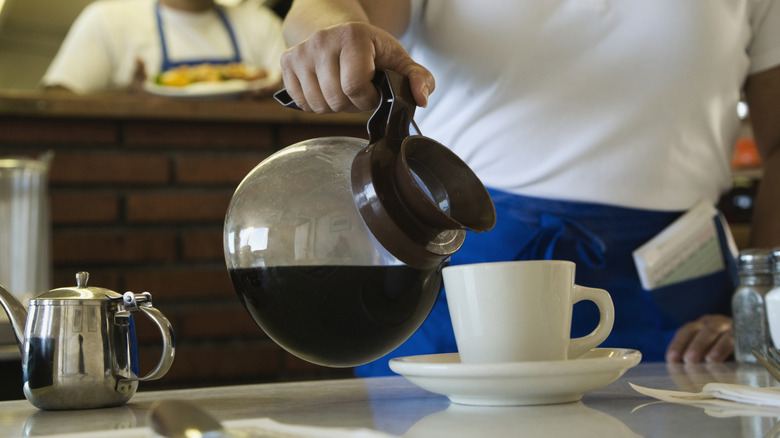 waitress pouring coffee