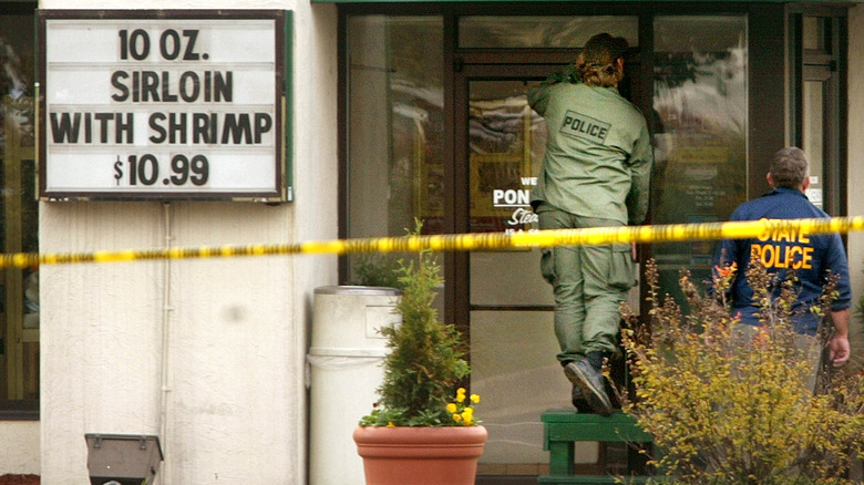 Police approach a Ponderosa Steakhouse