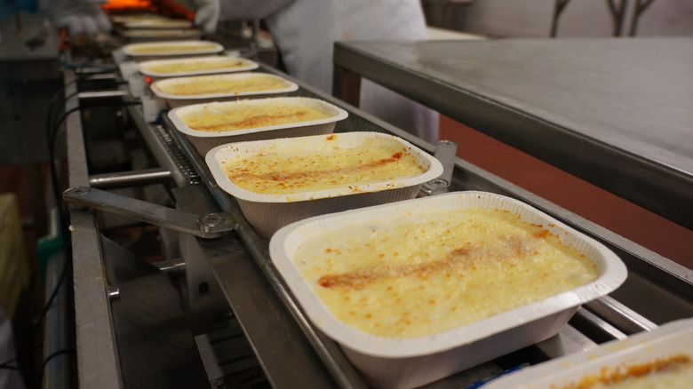 frozen dinners on assembly line