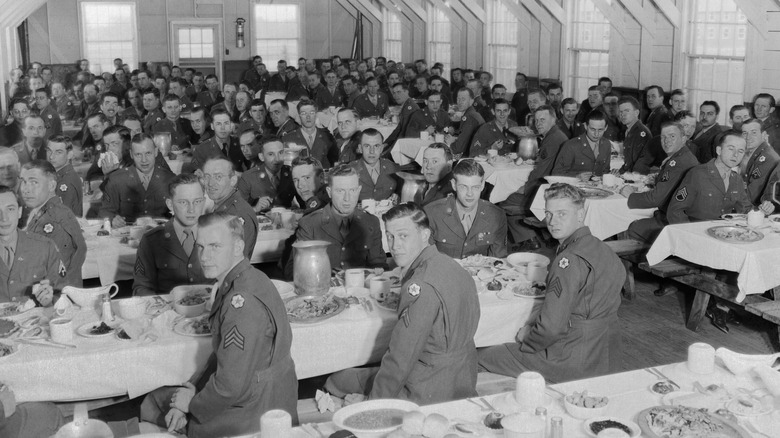 soldiers eating in mess hall in 1940s