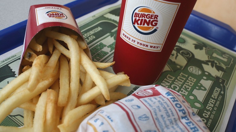 Burger King drink, fries, and Whopper on blue tray