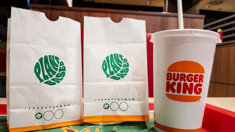 White bags of plant based food with Burger King cup