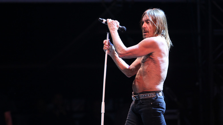 Iggy Pop holding microphone