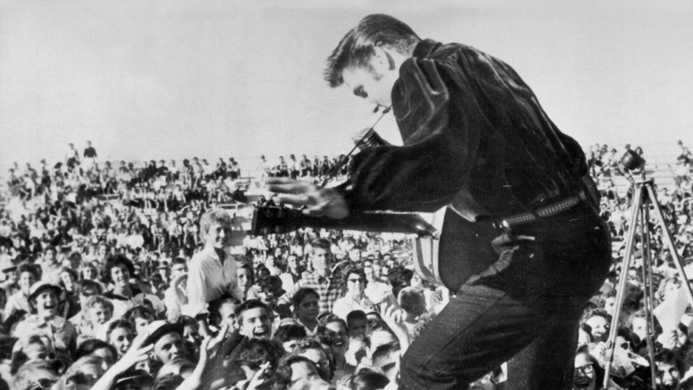 Elvis Presley performing at concert