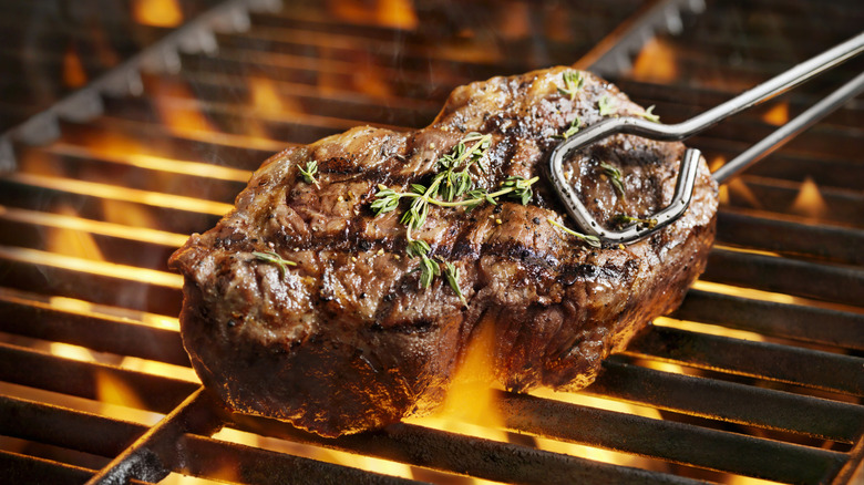 Close-up of steak on grill