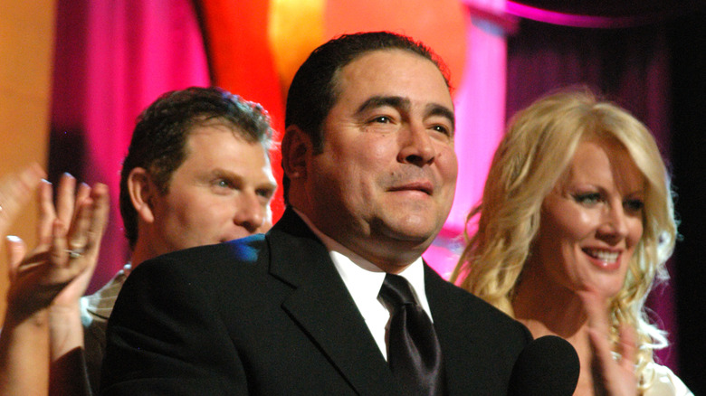 Emeril holding a microphone