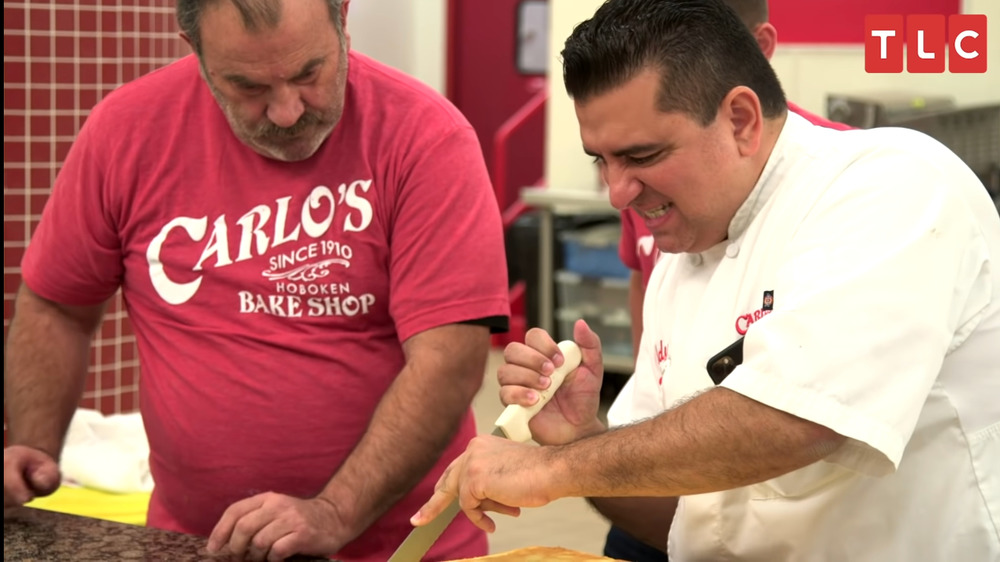 Buddy Valastro trims sheet cake