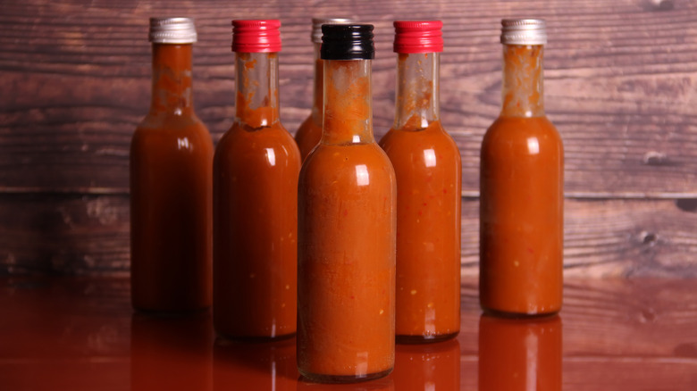 Hot sauce bottles on table