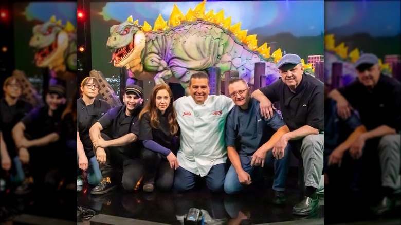 buddy valastro with team and godzilla cake