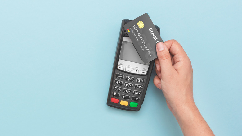 Bank card being used at a payment terminal