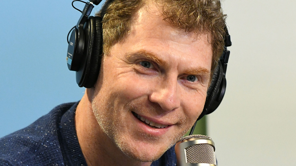 Bobby Flay wearing headphones