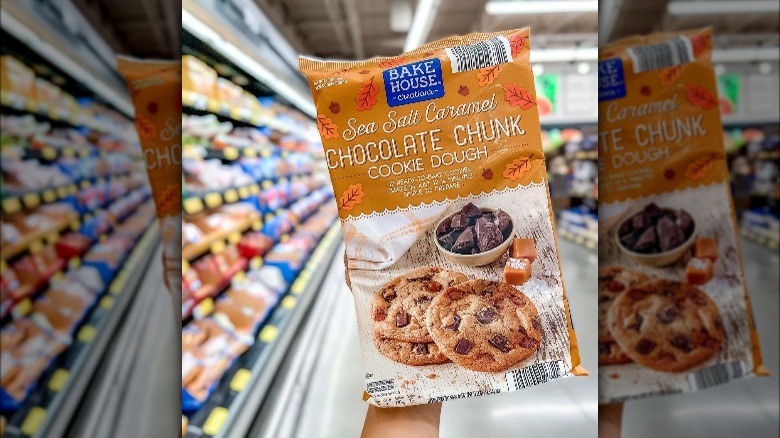 Person holding a package of Bakehouse Creation's Sea Salt Caramel Chocolate Chunk cookie dough from aldi.