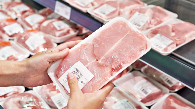 customer choosing packaged meat