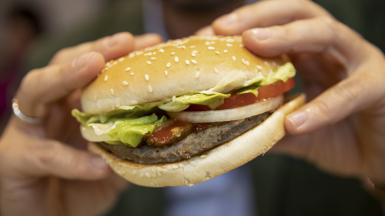 woman holding veggie burger