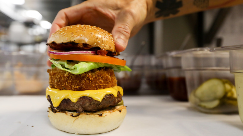 chef making gourmet burger