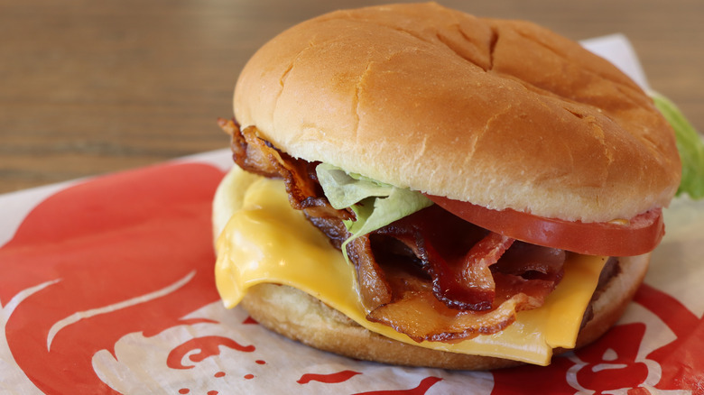 Wendy's junior bacon cheeseburger unwrapped, restaurant interior