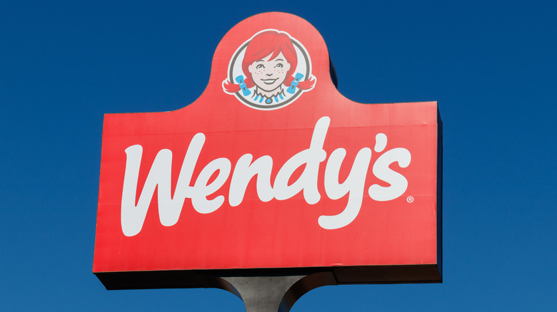 Wendy's red sign with logo, minimalist design