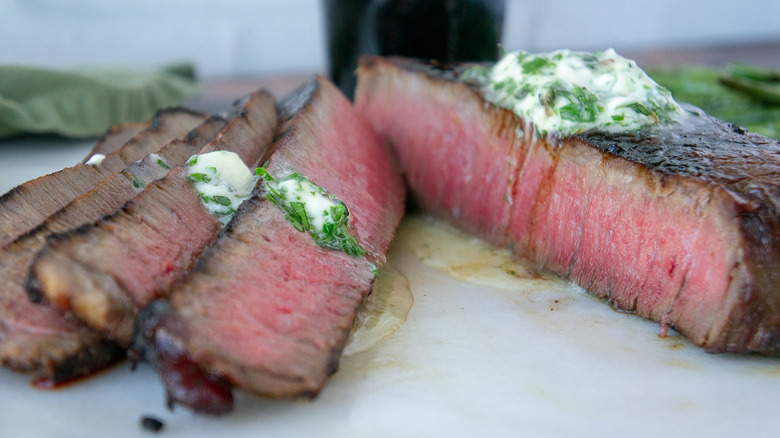 Sliced steak with herb butter