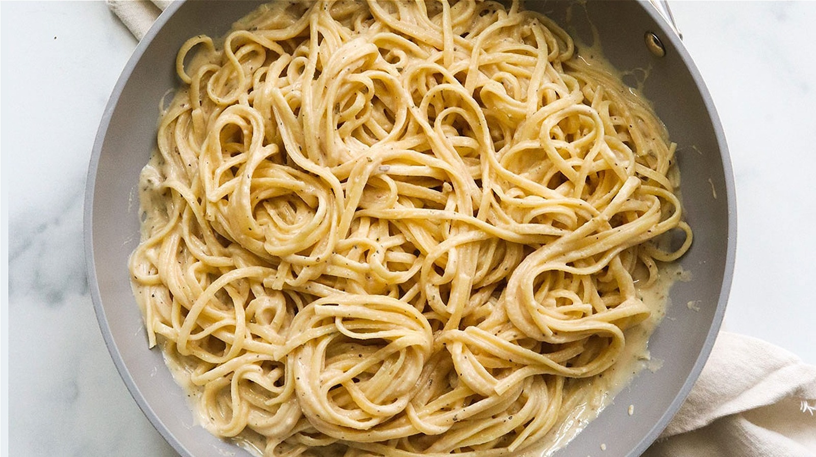 The Secret Ingredient That Gives A Creamy Texture To Dairy-Free Pasta