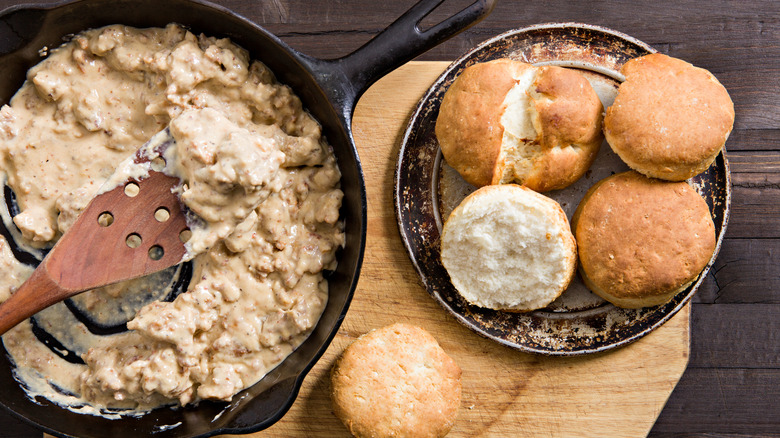 Gravy skillet with plated biscuits