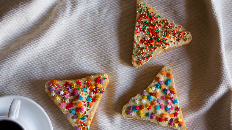 fairy bread cut into triangles.