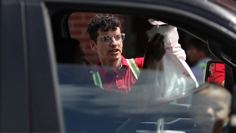 Chick-fil-A employee serving a guest