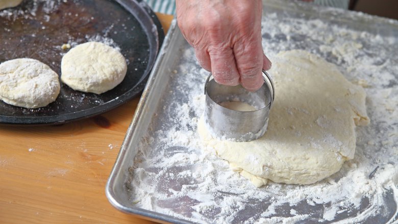 cutting out biscuit dough