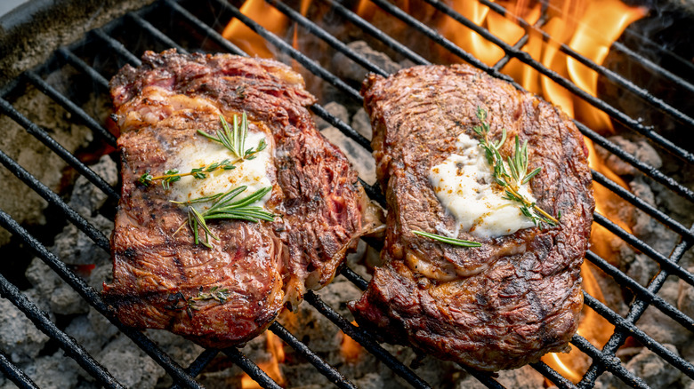 thick steaks on a grill