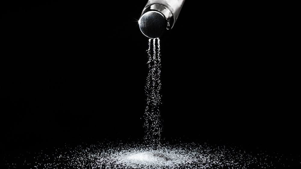 Salt being poured from a salt shaker