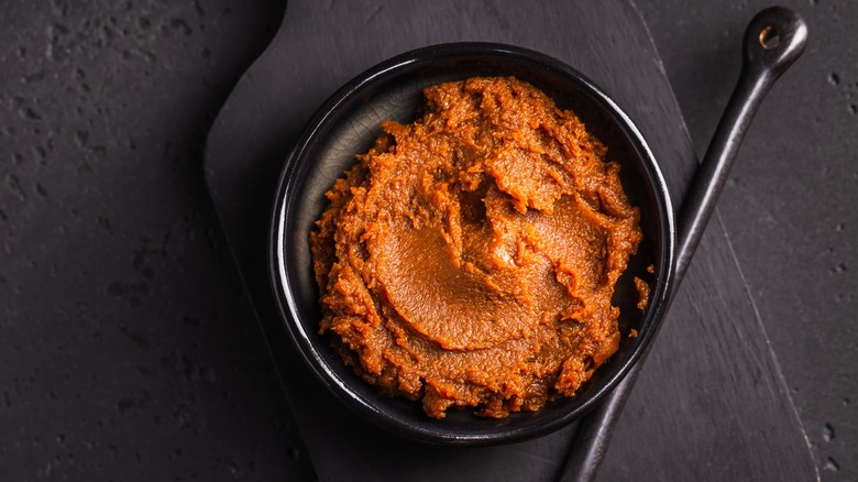 miso paste in black bowl