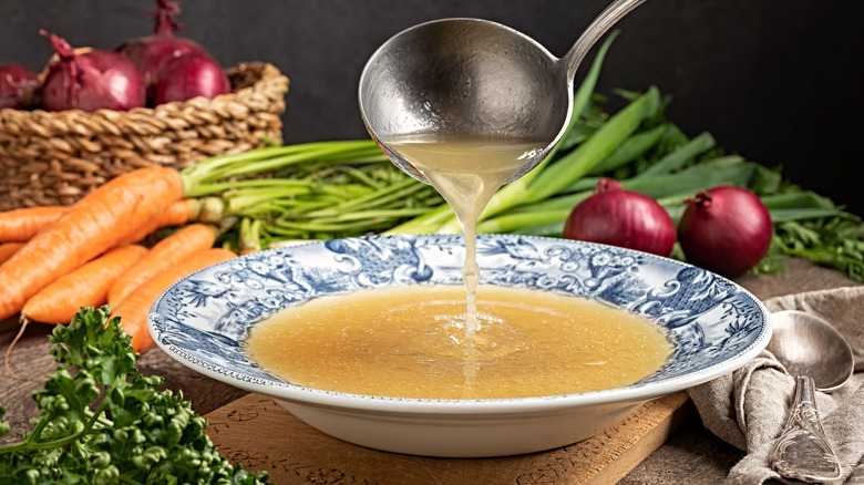 ladling stock into bowl