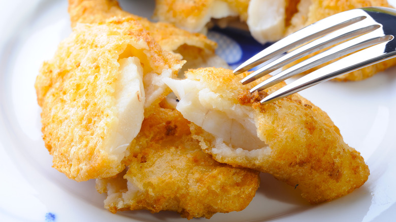 Fried white fish on plate