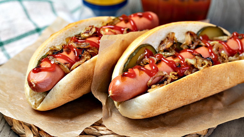 Hot dogs with ketchup and pickles