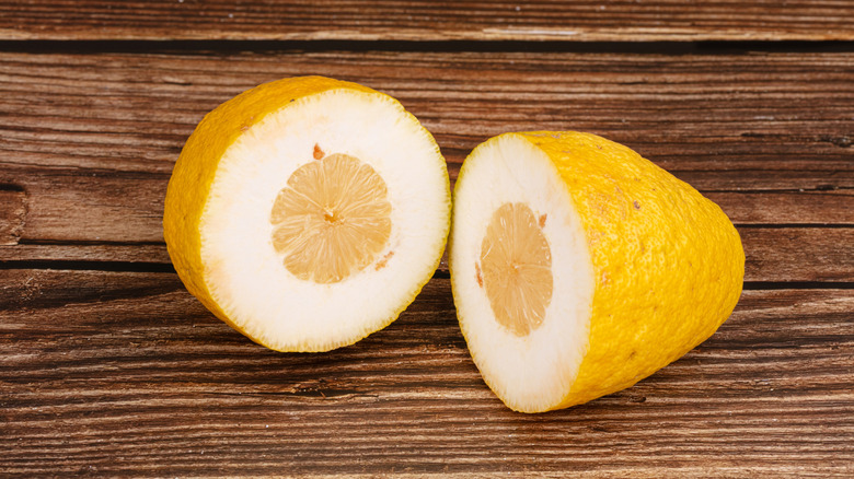 sliced citron on wooden board