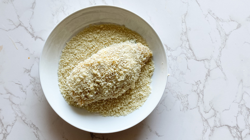 chicken kiev being breaded