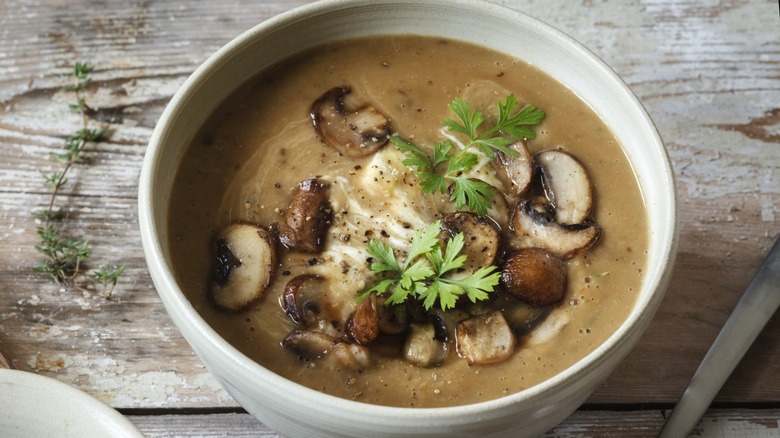 Bowl of mushroom soup with garnish