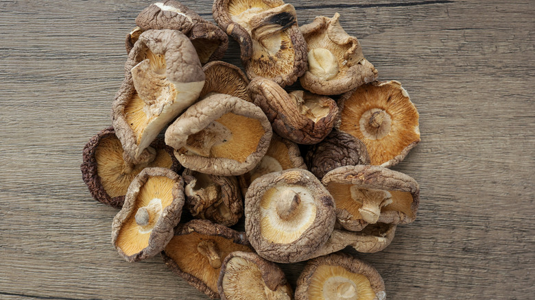 Pile of dried shiitake mushrooms on table