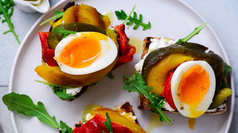 soft-boiled eggs atop bruschetta