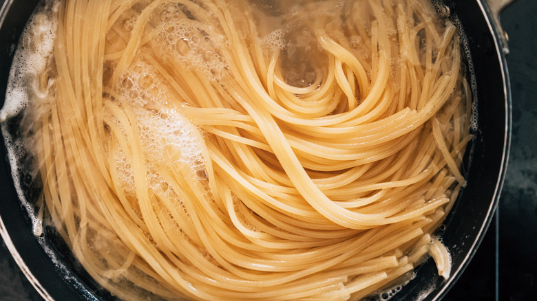 spaghetti boiling in a pot