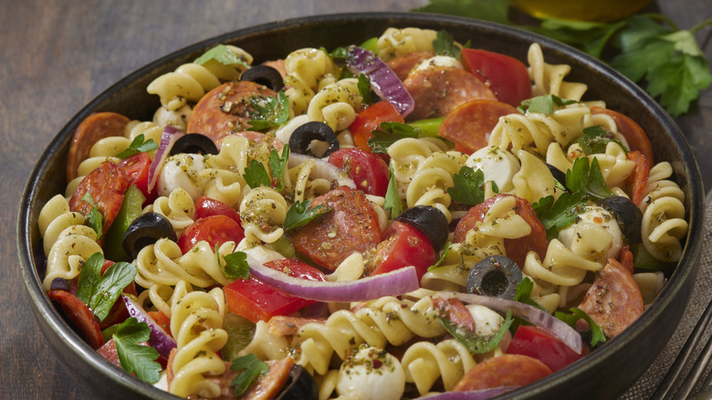 Bowl of pasta salad with sausage and veggies