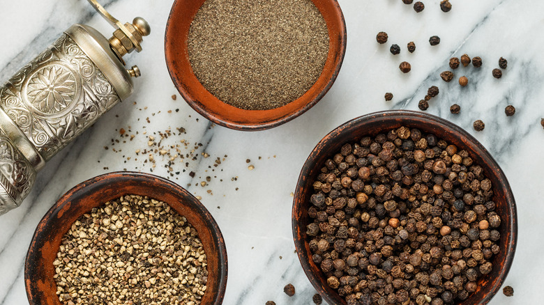 Black peppercorns and ground with pepper mill