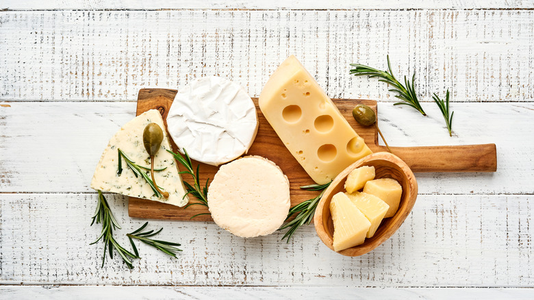 Cheese board on white wood