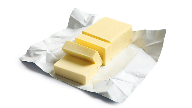 Chopped squares of butter on a butter wrapper 