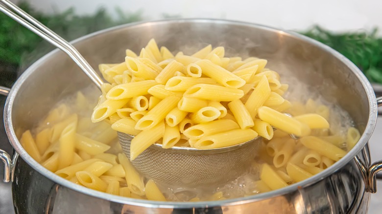 Straining pasta from water