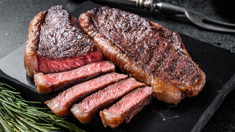 sirloin steaks on cutting board