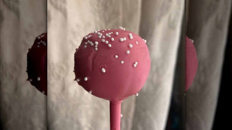 Starbucks birthday cake cake pop with darker pink frosting than usual