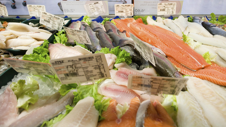 Supermarket seafood section with various types of fish