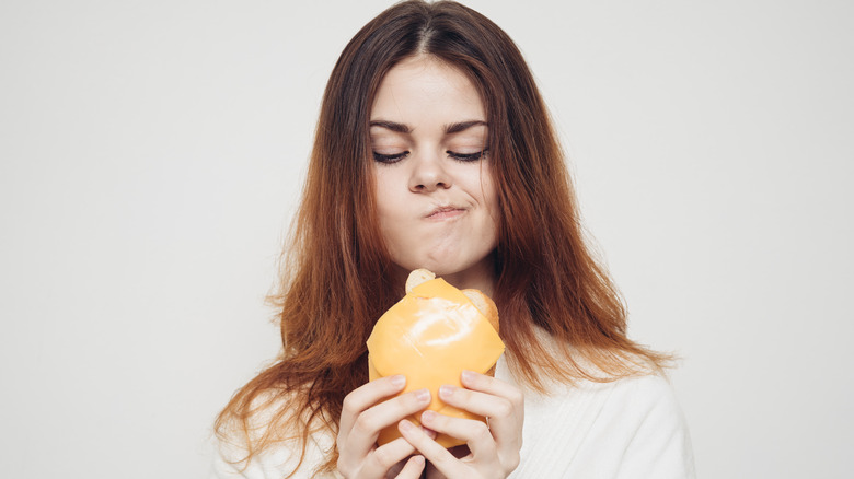 Woman contemplating food